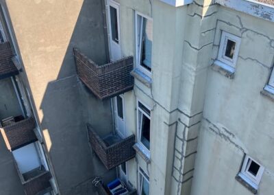 Renovatie achtergevel en balkons voor situatie